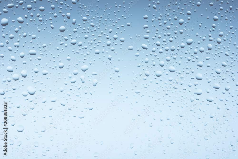 Macro photo of water drops on blue background Macro photo of water drops on blue background