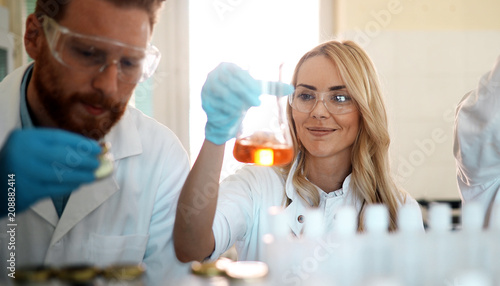 Attractive student of chemistry working in laboratory