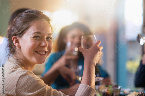 Wallpaper Mural Mixed group of friends having fun while sharing a meal  Torontodigital.ca