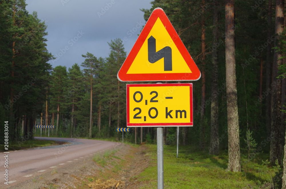 Winding road ahead sign in Dalarna Winding road ahead sign in Dalarna