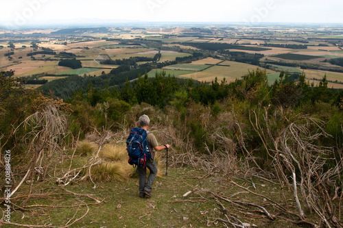 Tourist looks from a hill at Canterbury plains photo