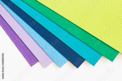 Flat lay of colored card, textured paper, stationery flat lay