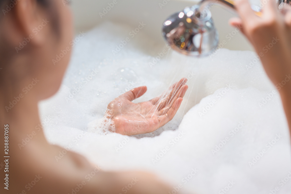 Woman relaxing in bathtub Woman relaxing in bathtub