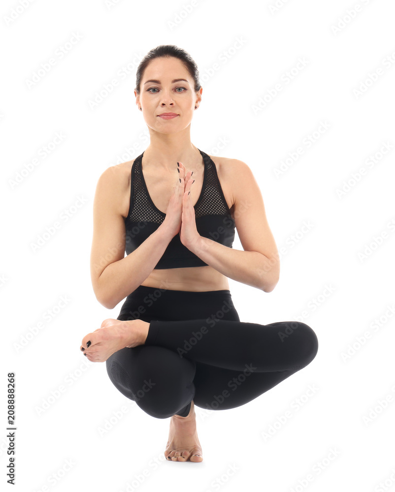 Young woman practicing yoga on white background