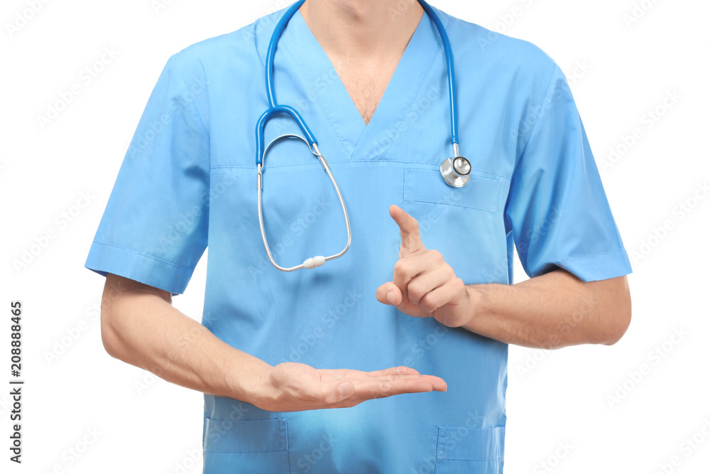 Male doctor showing something on white background Male doctor showing something on white background