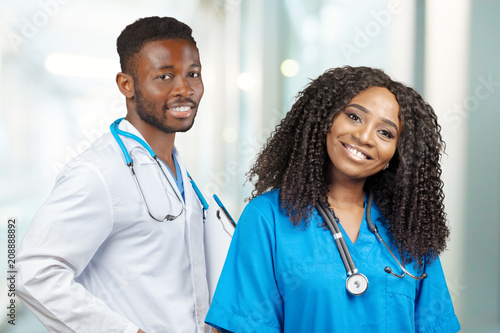 Confident African American medical professionals in hospital