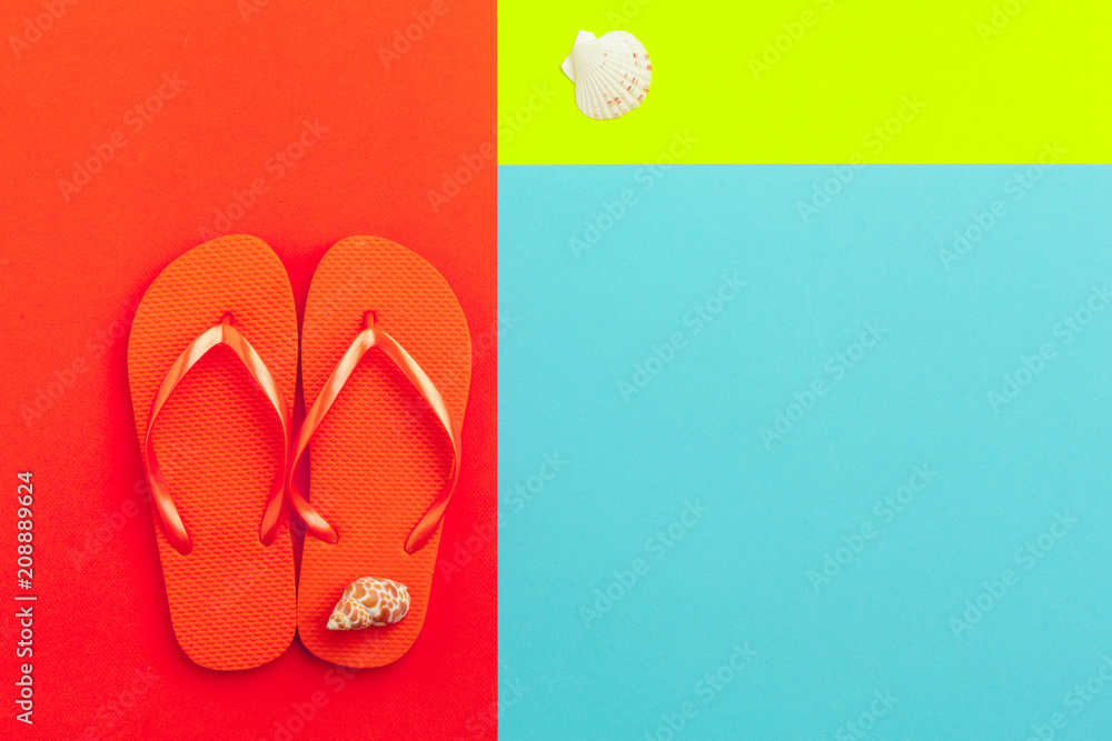 Female flip flops on a color block background
