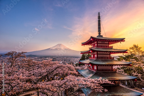 Fujiyoshida, Japan Beautiful view of mountain Fuji and Chureito pagoda at sunset, japan in the spring with cherry blossoms photo