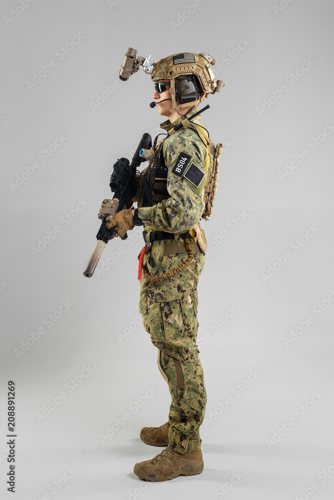 Special forces soldier with rifle on white background. Special forces soldier with rifle on white background.