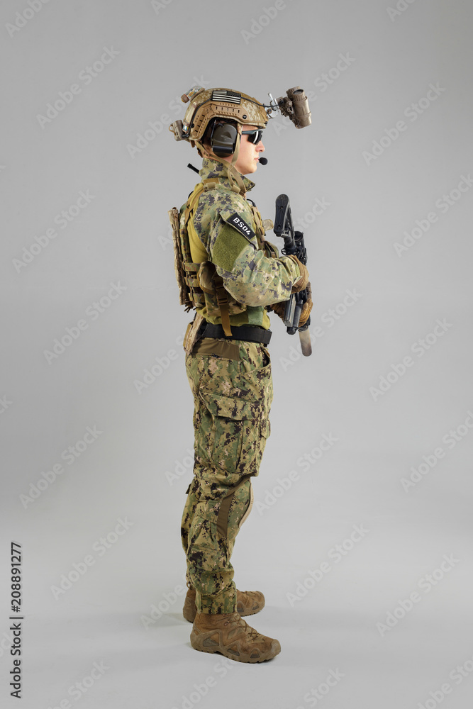 Special forces soldier with rifle on white background. Special forces soldier with rifle on white background.