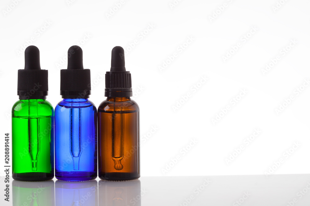 Fototapeta premium Cosmetic bottles with pipette