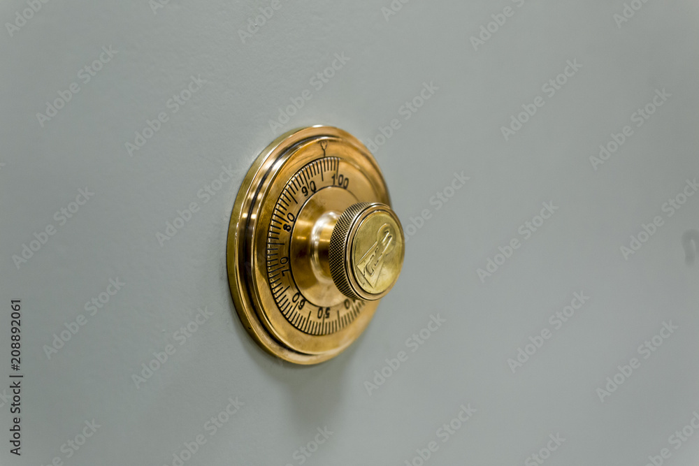 Combination safe lock, in golden duotone. Combination safe lock, in golden duotone.