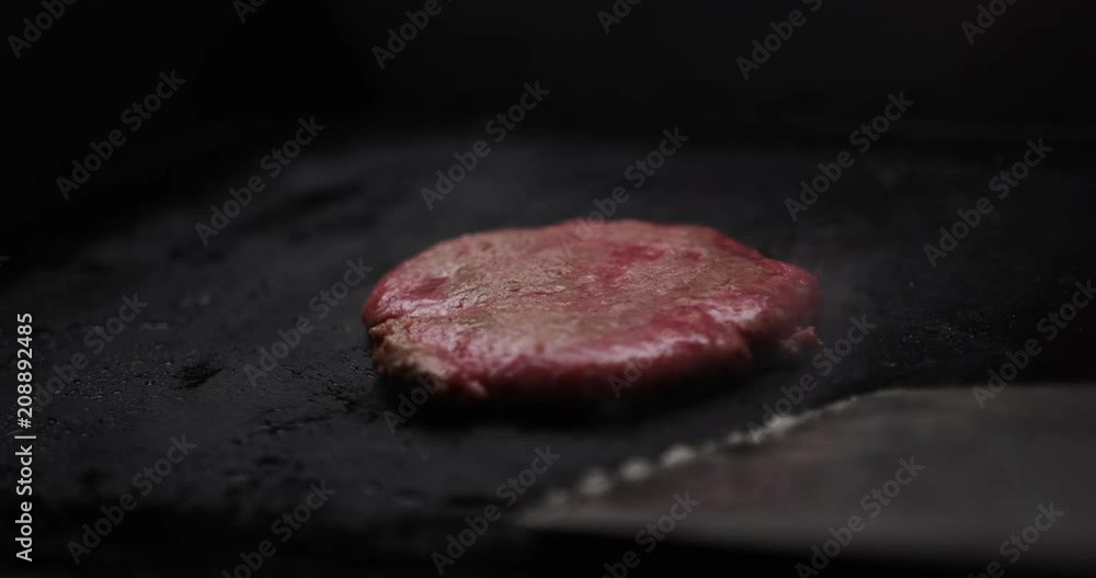 hopped meat fried on the stove and turned over with a spatula. Cutlet hopped meat fried on the stove and turned over with a spatula. Cutlet