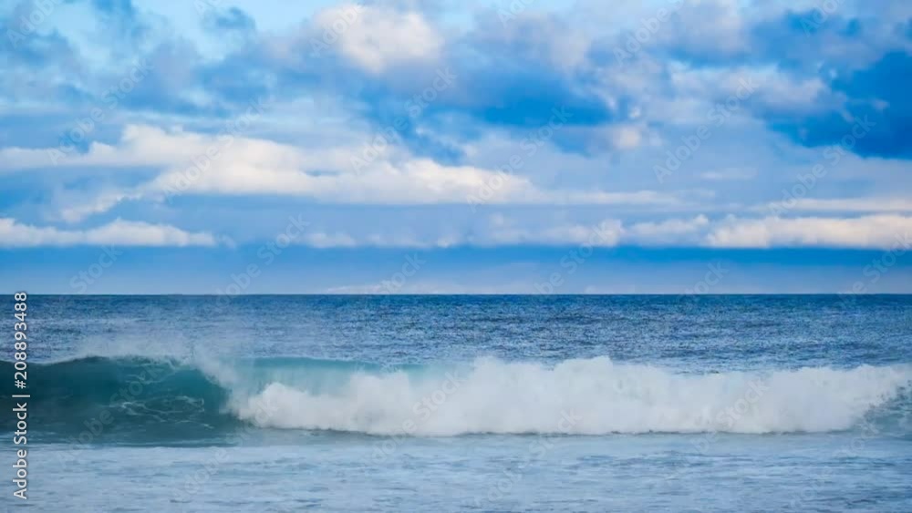 wave crash and go down in the ocean water. white sponge and blue sea perfect for nice surf activity or vacation place wave crash and go down in the ocean water. white sponge and blue sea perfect for nice surf activity or vacation place