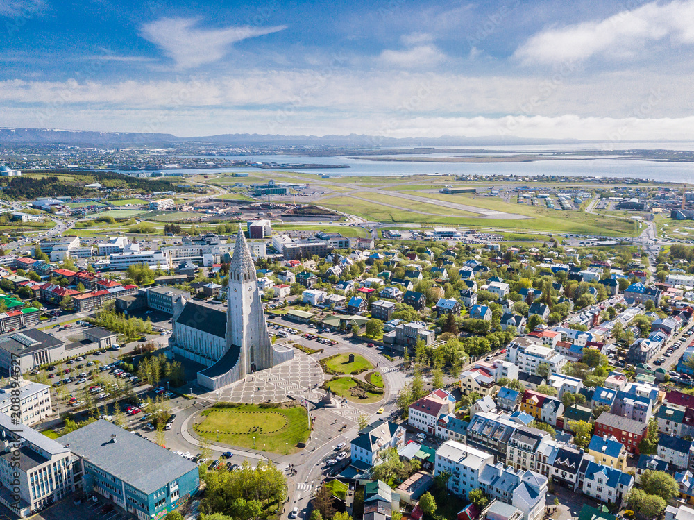 Reykjavik Iceland city scape frop the top with Hallgrimskirkja church. Aerial photo. religious building - obrazy, fototapety, plakaty 