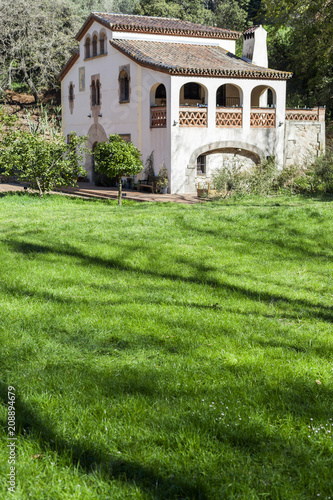 Ancient Masia, rural house in historic botanic garden, Montjuic park of Barcelona. photo