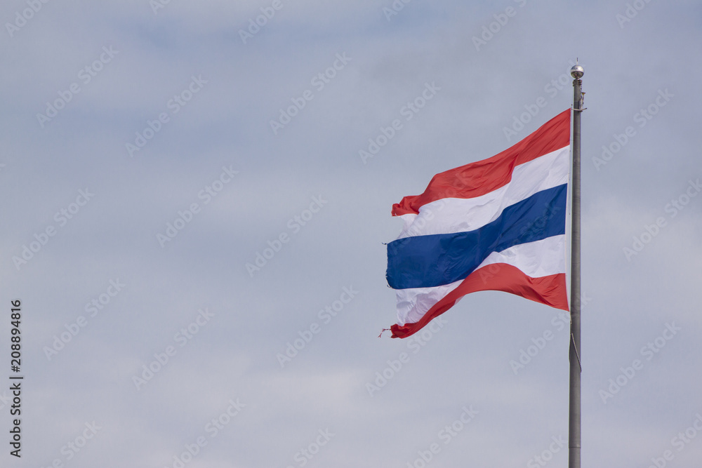 Thailand flag on the pole with sky is waving.