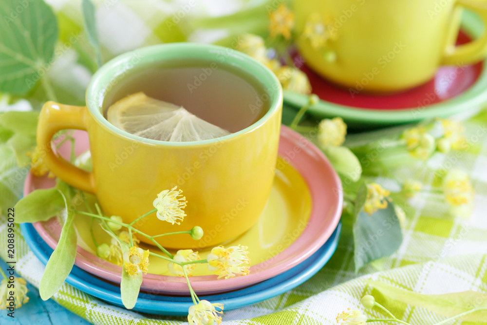 Cups of herbal tea with linden blossoms and lemon Cups of herbal tea with linden blossoms and lemon