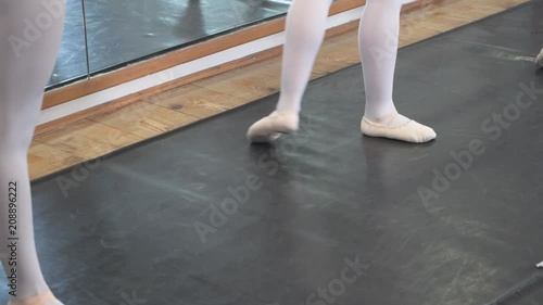 4K young ballerina during ballet class photo