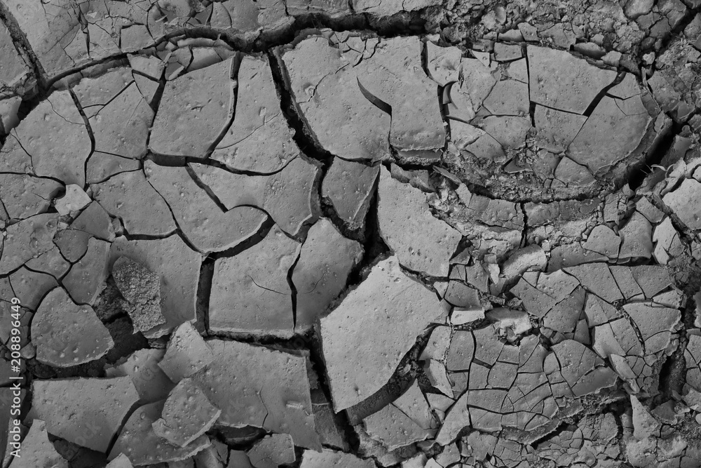 cracked soil. dry land with deep cracks. drought. cracked soil. dry land with deep cracks. drought.