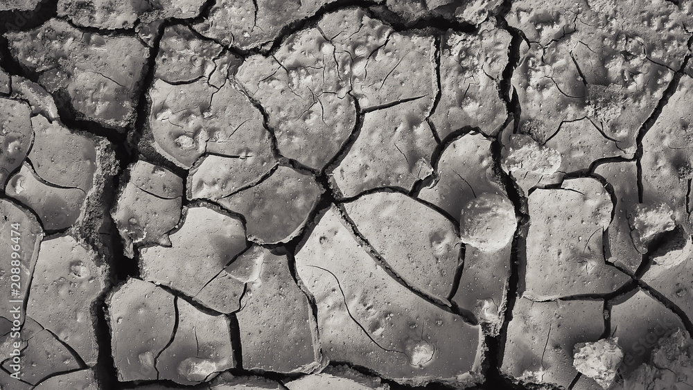 cracked soil. dry land with deep cracks. drought. cracked soil. dry land with deep cracks. drought.