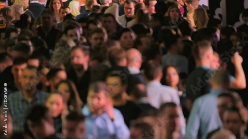 Crowd of walking people walking indoors. Overpopulation concept