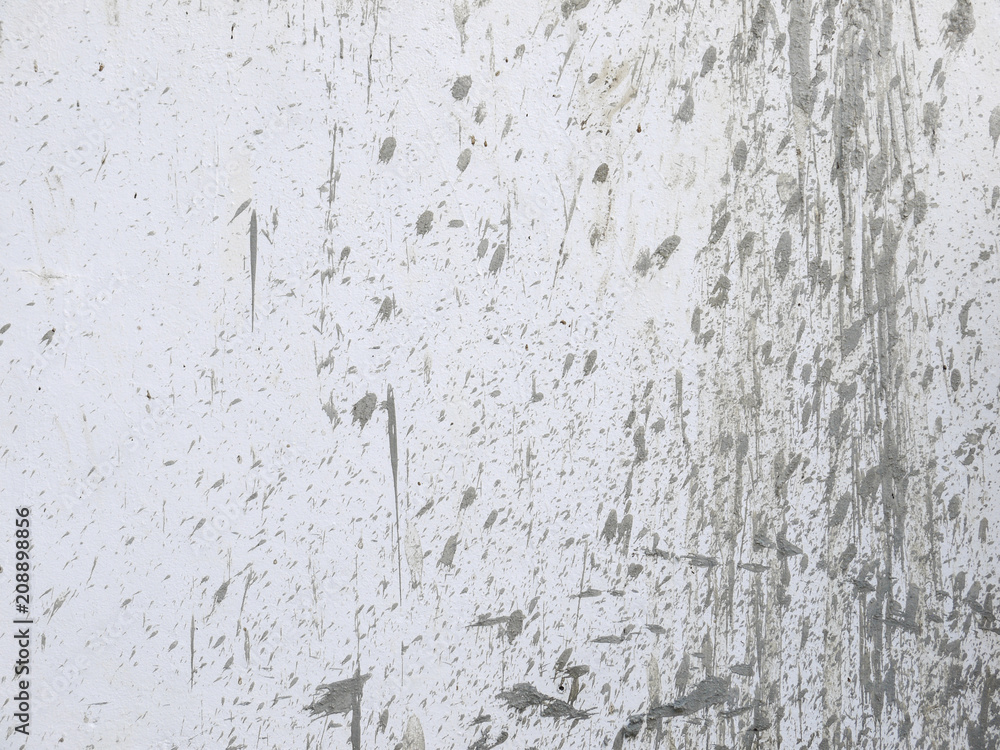 Fototapeta premium drops of mud on a white wall background