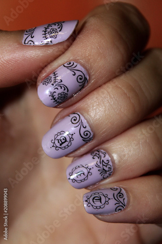 purple nail polish with black patterns