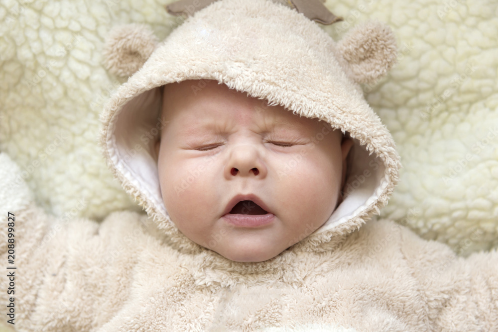 Portrait of a cute sneezing kid in a deer suit Portrait of a cute sneezing kid in a deer suit