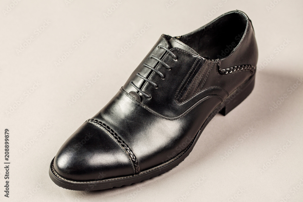 Black men shoes against gray background Black men shoes against gray background