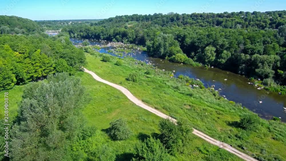 a beautiful summer landscape the drone flies out for a halm opening the view of the river a beautiful summer landscape the drone flies out for a halm opening the view of the river