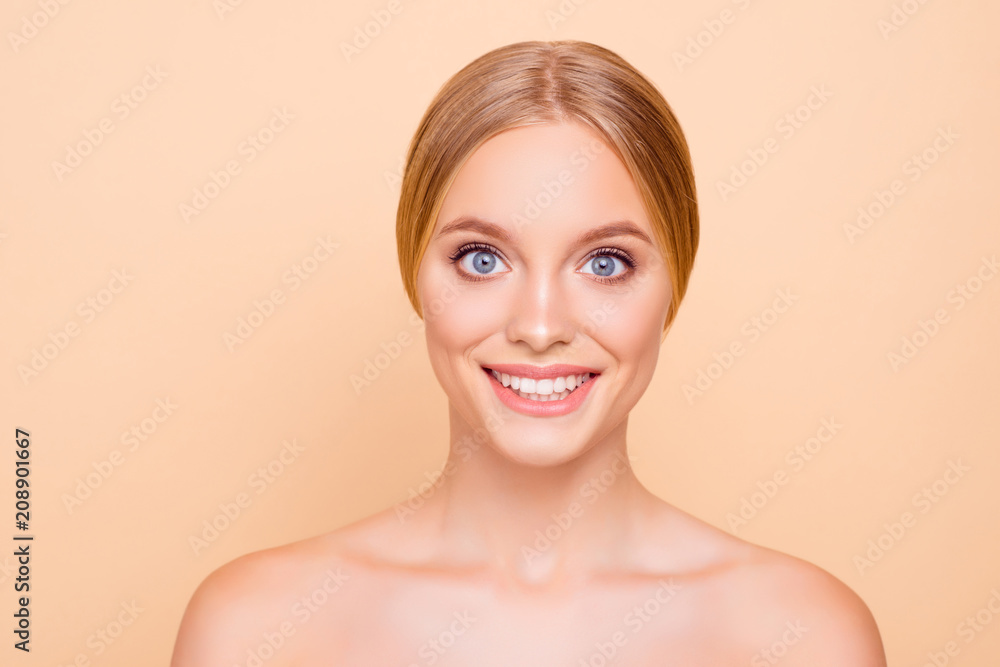 Portrait of cute cheerful girl with perfect ideal skin after mask, lotion, cream, peeling, isolated on beige background, daily everyday care concept, looking at camera Portrait of cute cheerful girl with perfect ideal skin after mask, lotion, cream, peeling, isolated on beige background, daily everyday care concept, looking at camera