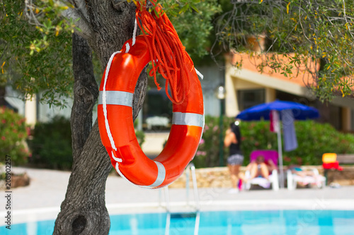 Lifebuoy by the pool at summer holiday resort 