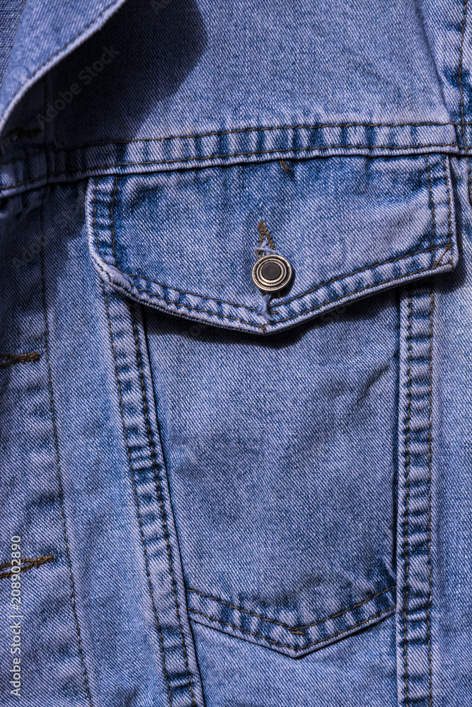 Breast pocket of denim jacket shot close-up. Breast pocket of denim jacket shot close-up.