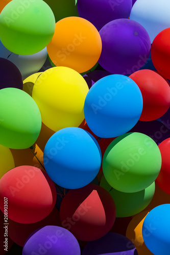 Background of a set of colored balloons on the sky background 