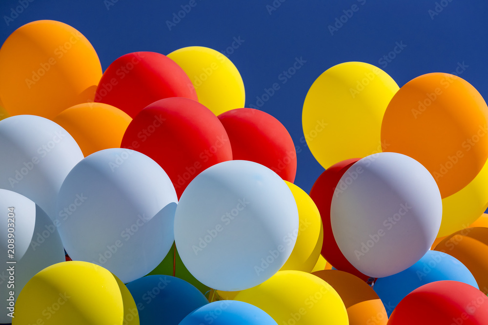 Background of a set of colored balloons on the sky background Background of a set of colored balloons on the sky background