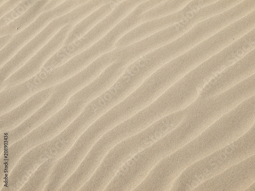 Sand texture.Dented wave of the blow of the wind © srckomkrit