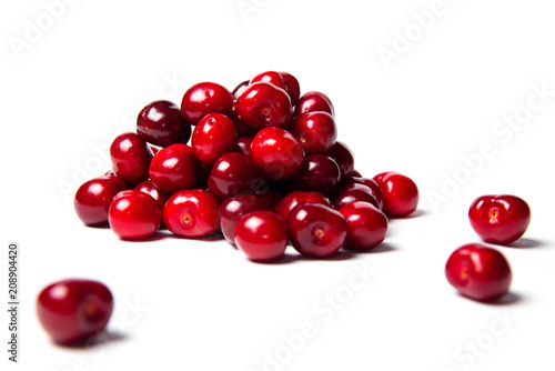 Heap of ripe fresh red cherry food on a white background isolated