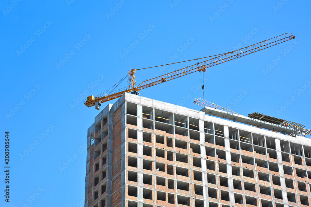 Crane and highrise construction site