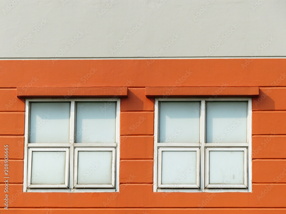 Window with frame on orange wall Window with frame on orange wall