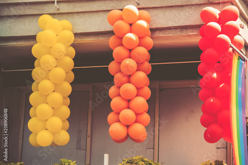 Multi Colored balloons hang on the balcony in Tel Aviv, Israel.