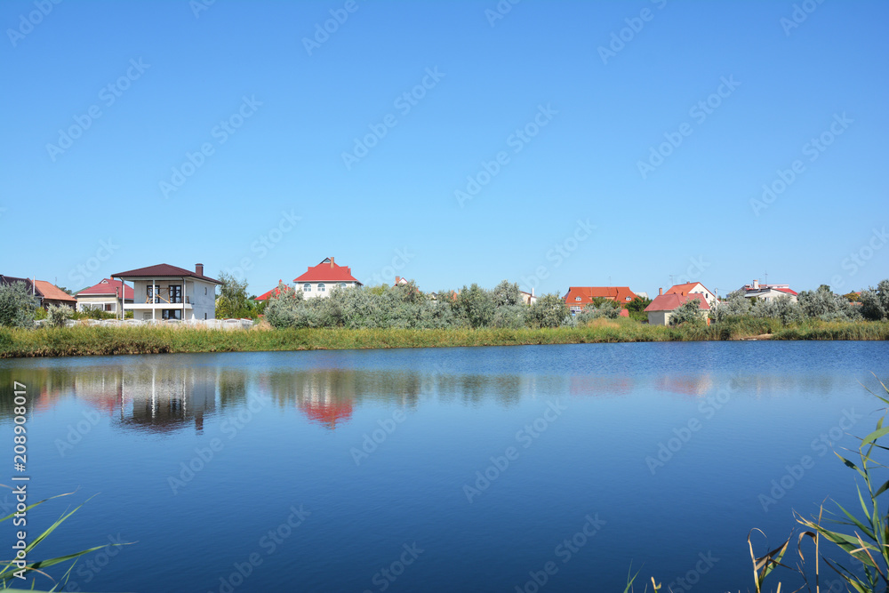 Cottage houses on the lake bank with beautiful view.