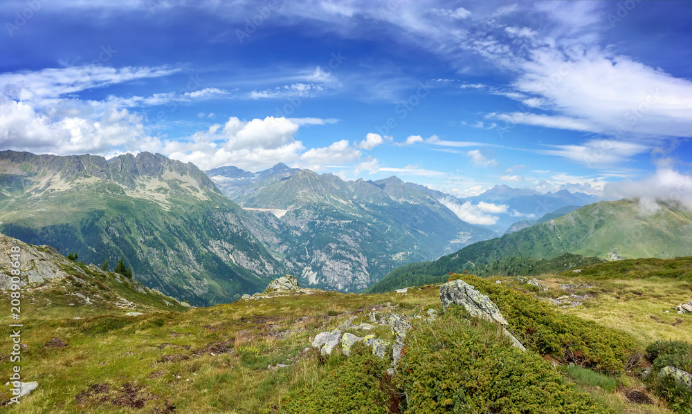 Panorama of the Alps in summer. View on the Emosson dam in Switzerland during Tour du Mont Blanc hike
