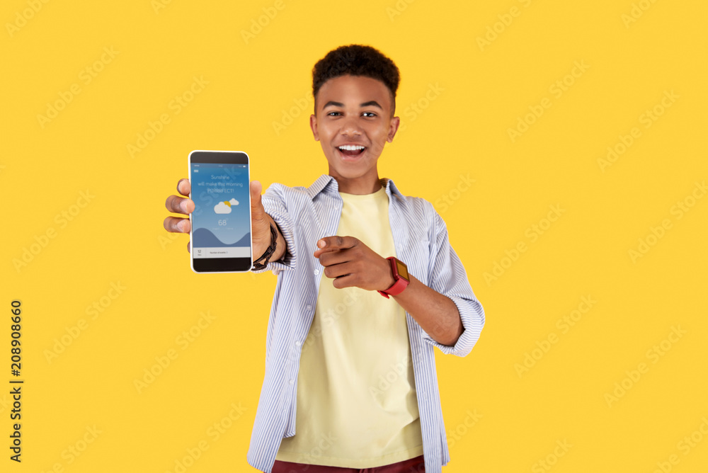 Weather forecast. Positive nice man using a mobile app while checking the weather forecast Weather forecast. Positive nice man using a mobile app while checking the weather forecast