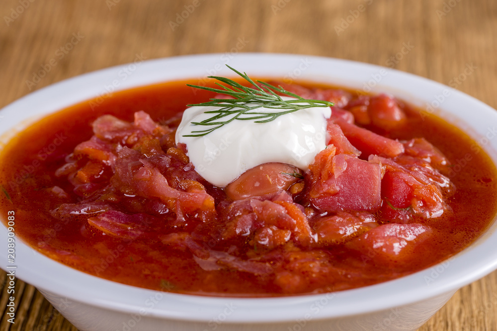 Vegetable soup - red borsch, closeup. Healthy beetroot soup, vegetarian food. Ukrainian and russian national food - red beet soup, borscht Vegetable soup - red borsch, closeup. Healthy beetroot soup, vegetarian food. Ukrainian and russian national food - red beet soup, borscht