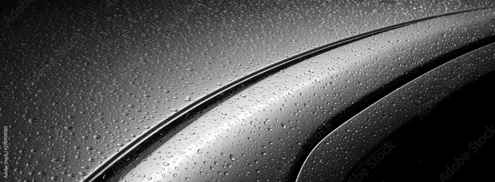 Naklejka premium krople wody na samochodzie po deszczu