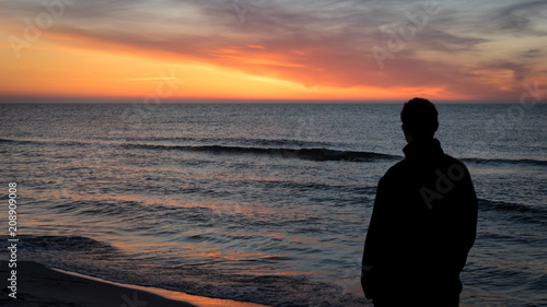 Man Watching Sunset from Beach Baltic Sea Poland 