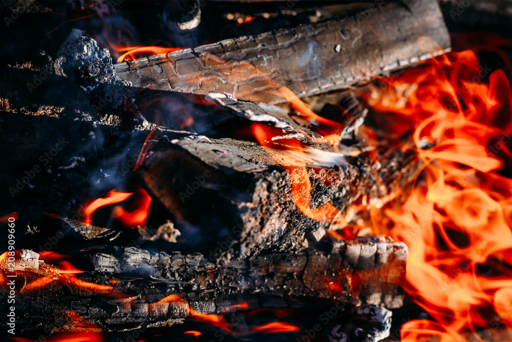 Burning charcoal embers firewood with ashes and flames Burning charcoal embers firewood with ashes and flames