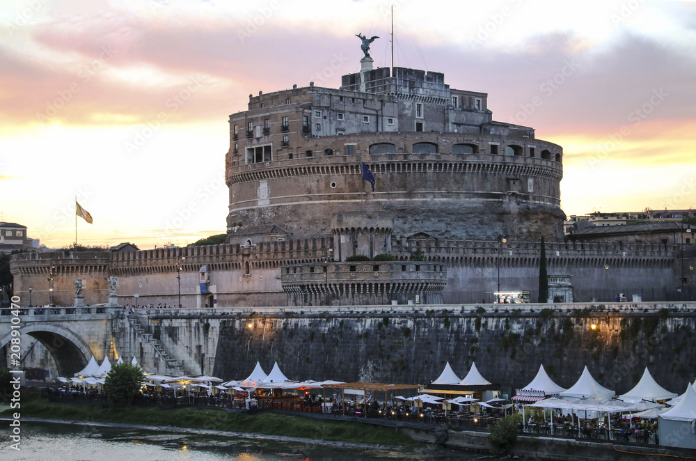 View of the Saint Angel Castle and the Tiber river on the sunset in Rome,Italy.