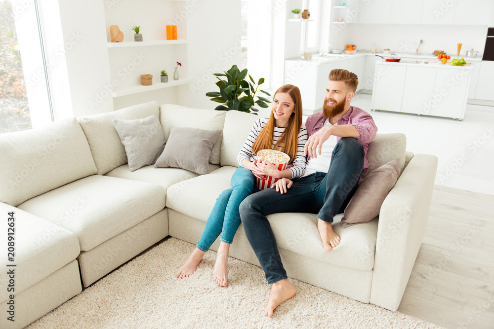 Day freetime chill two partners people ginger hair vacation concept. Cute sweet careless handsome beautiful excited cheerful lovers eating pop corn from basket watching favorite film in living room Day freetime chill two partners people ginger hair vacation concept. Cute sweet careless handsome beautiful excited cheerful lovers eating pop corn from basket watching favorite film in living room